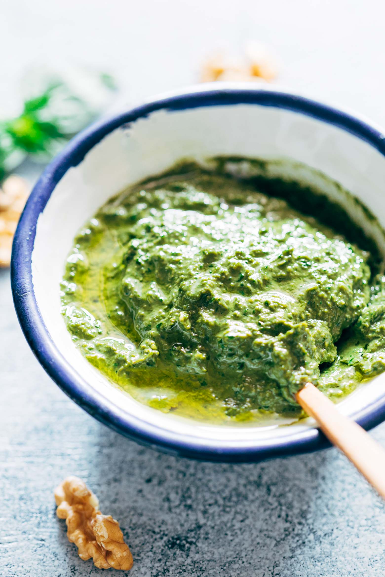 Basil Walnut Pesto is a super easy, homemade vegan pesto recipe that is perfect with pasta dishes, salads, on chicken and salmon as a sauce or even as a dip! The walnuts give it a creamy base which helps avoid the parmesan altogether, and are a great substitute to pine nuts. 