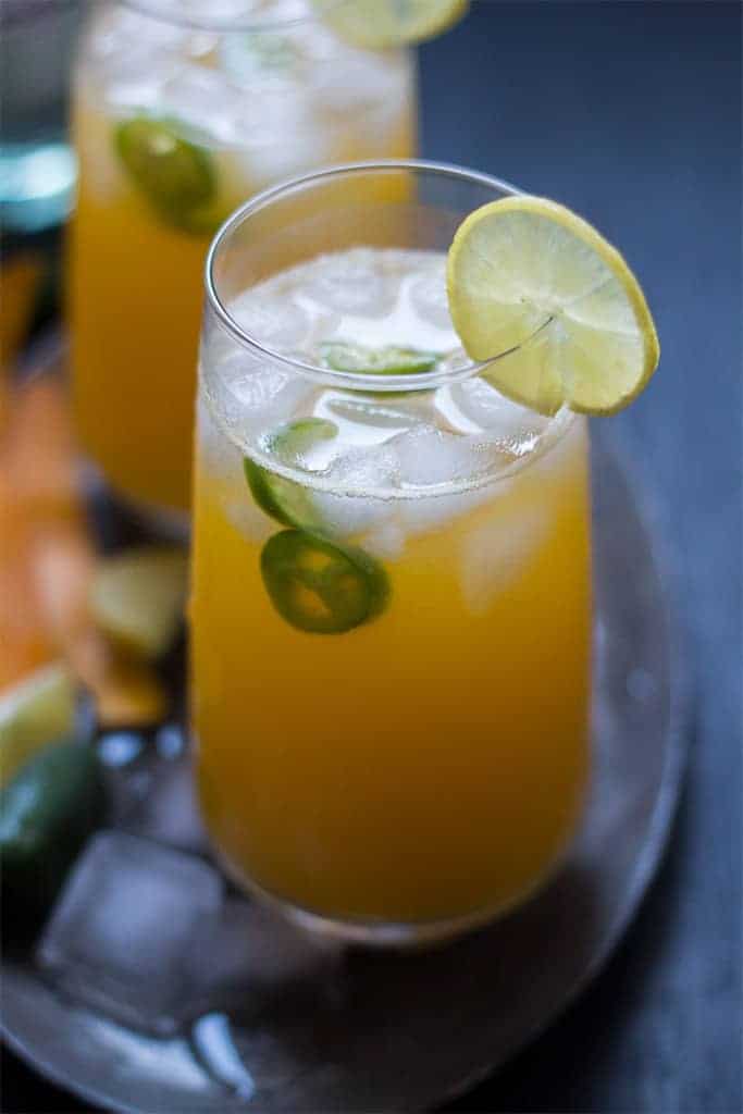 Tall Mango Jalapeno Fizzy Cocktail is a super fun and refreshing brunch drink which combines the sweetness of mangoes with a spicy kick from Jalapenos.