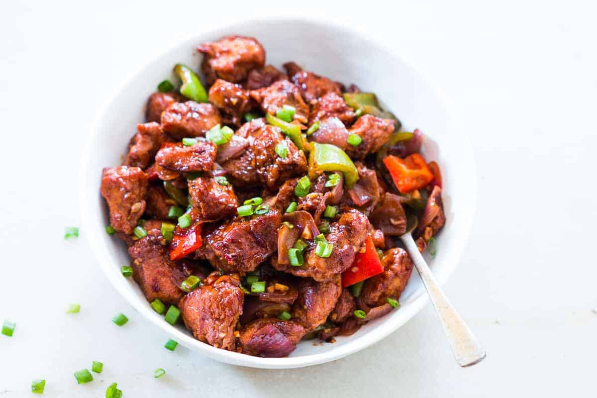 Easy recipe for Indian Chinese Chilli Chicken Dry. This will give you fool proof restaurant style chinese chilli chicken dry every time! It's sweet and sour, crispy and spicy. You can also make it with gravy, but dry is our favourite.