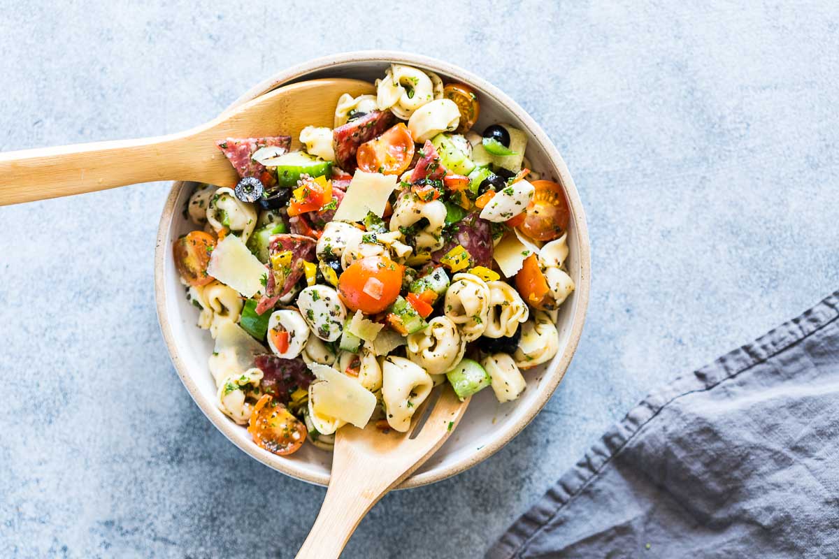 Italian Antipasto Tortellini Pasta Salad is the easiest, cold pasta salad that can be made ahead for picnics, barbecues and family lunches! Also get the recipe for homemade italian salad dressing.